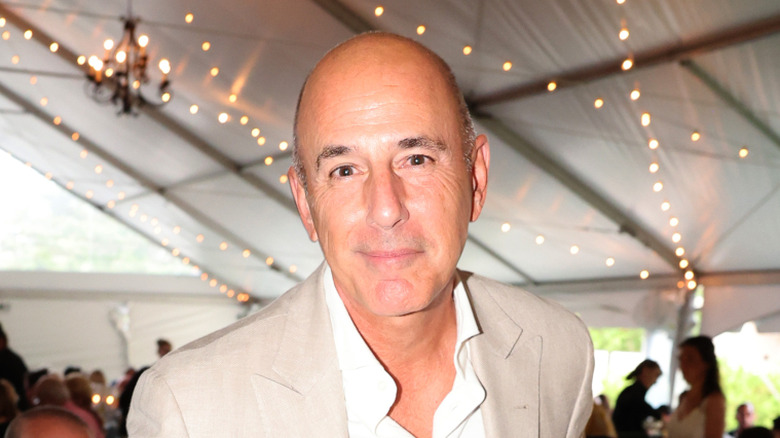 Matt Lauer wearing a beige jacket and white shirt