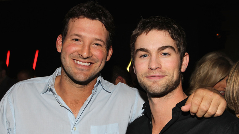 Tony Romo with his arm around Chace Crawford
