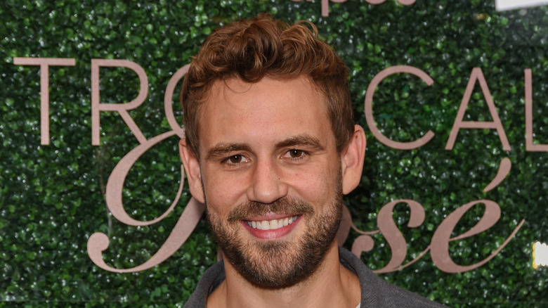 Nick Viall smiles at an event