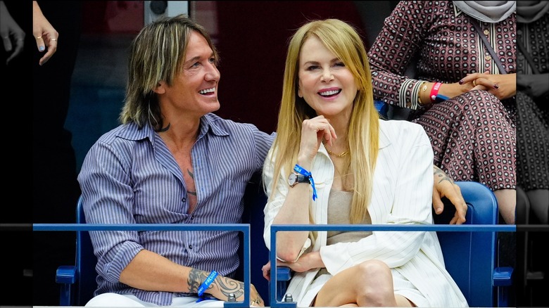 Nicole Kidman and Keith Urban pictured at the 2023 US Open tennis men's final, sitting together with Keith's arm around Nicole