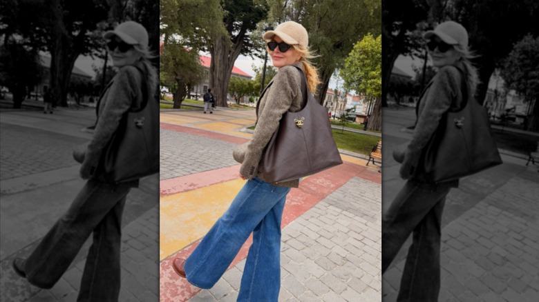 Nicole Kidman pictured on vacation in Chile, wearing jeans, boots, a jacket, a hat, and sunglasses