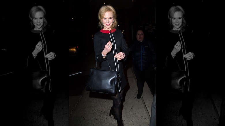 Nicole Kidman pictured arriving at an Uptown New York City hotel, wearing a black dress and holding a black leather bag