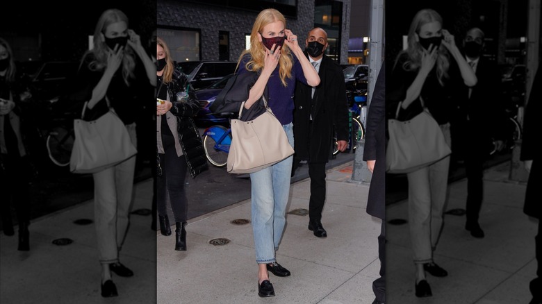 Nicole Kidman pictured arriving at the French Institute in New York City in 2021, wearing a face mask