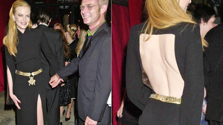 Nicole Kidman holding hands with a man