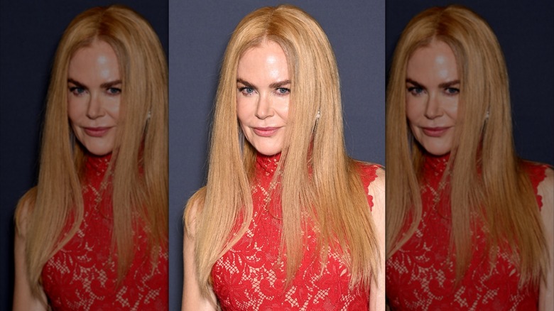 Nicole Kidman in a strawberry blonde wig and red dress at Cannes 2025.