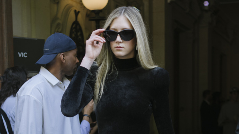 Sunday Rose (in black with sunglasses) at 2024 Paris Fashion Week
