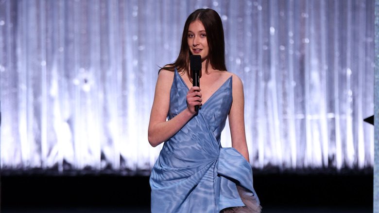 Sunday Rose (in blue) presenting an award at the Royal Albert Hall in 2025