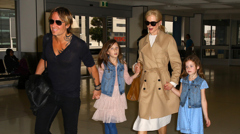 From left: Keith Urban, Sunday Rose, Nicole Kidman, and Faith Margaret at an airport in 2017