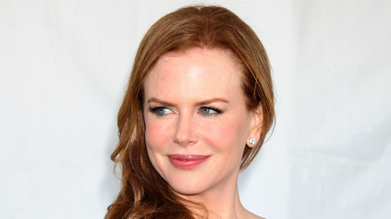 Nicole Kidman smiling with strawberry blonde hair 