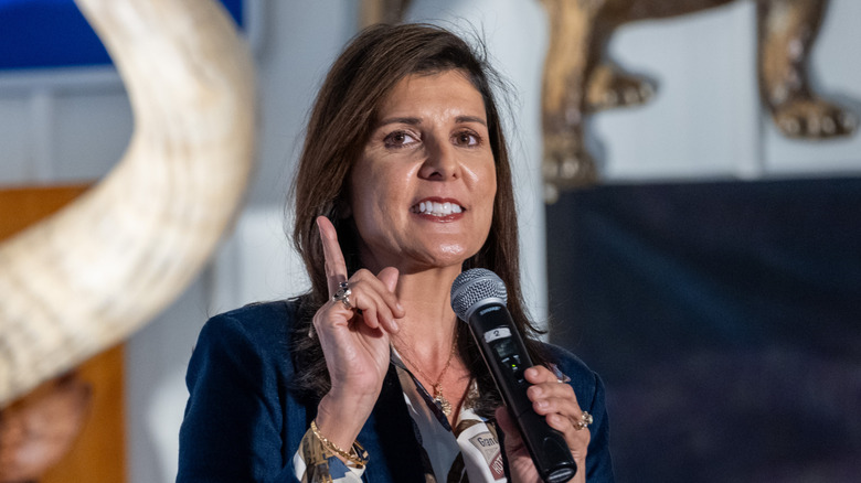 Nikki Haley speaking at a campaign rally in Pennsylvania while wearing a blue blazer and white collared shirt.