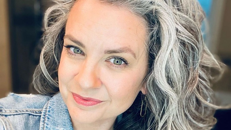 Woman with wavy gray hair