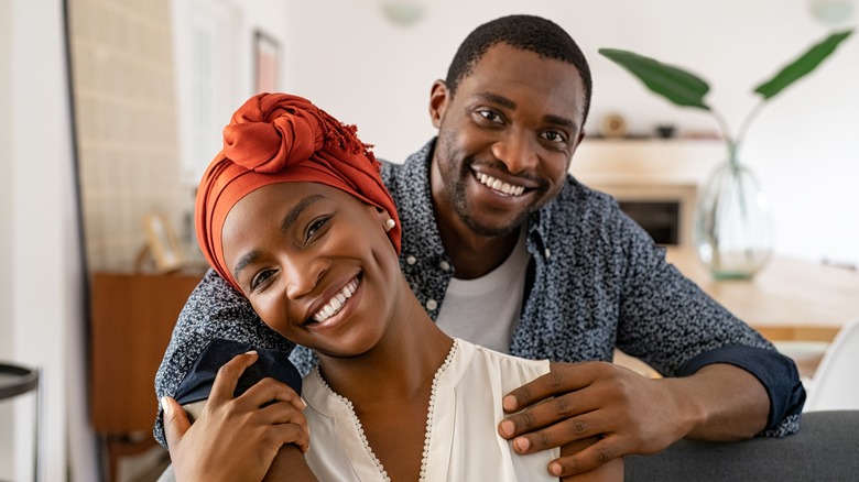 African American woman and man embracing