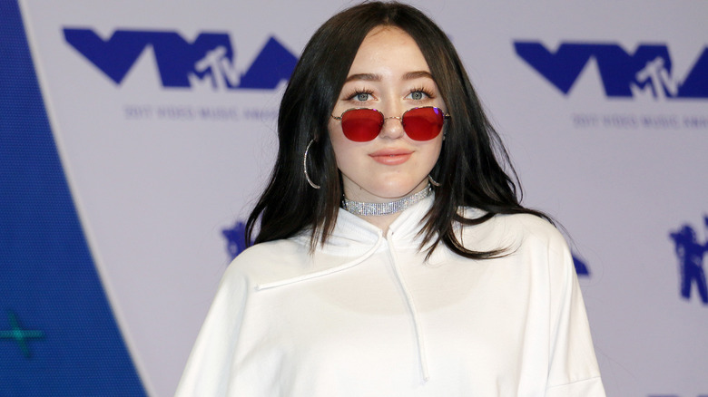 Noah Cyrus poses