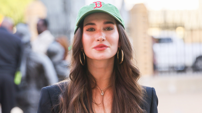 image of Auden Wyle smiling and wearing a cap while looking at the camera