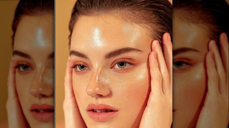 White woman with dewy skin who has used highlighter
