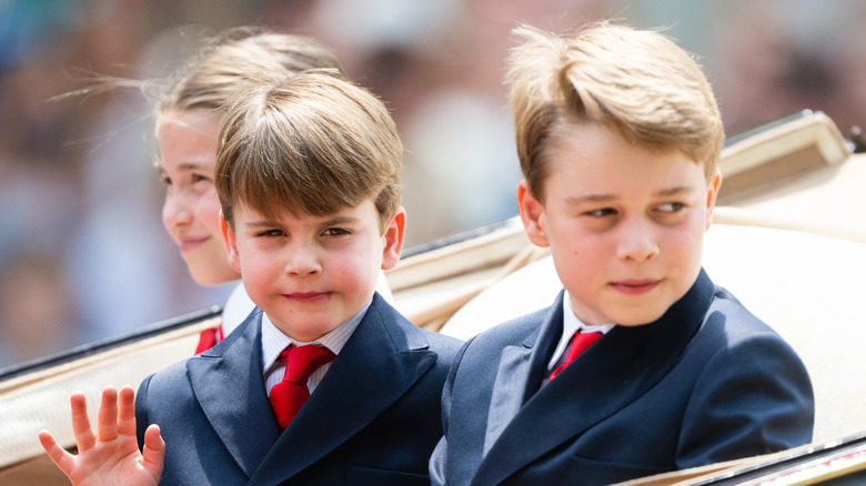 Prince George and Prince Louis in a carriage 