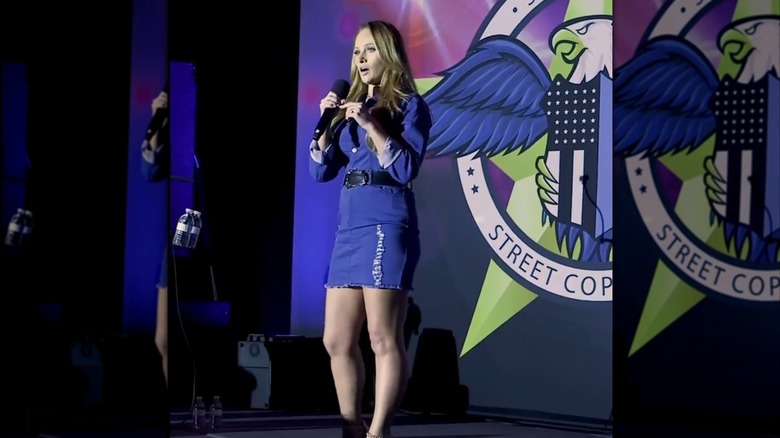 Tomi Lahren speaks on stage at a Street Cop Training conference (2021)