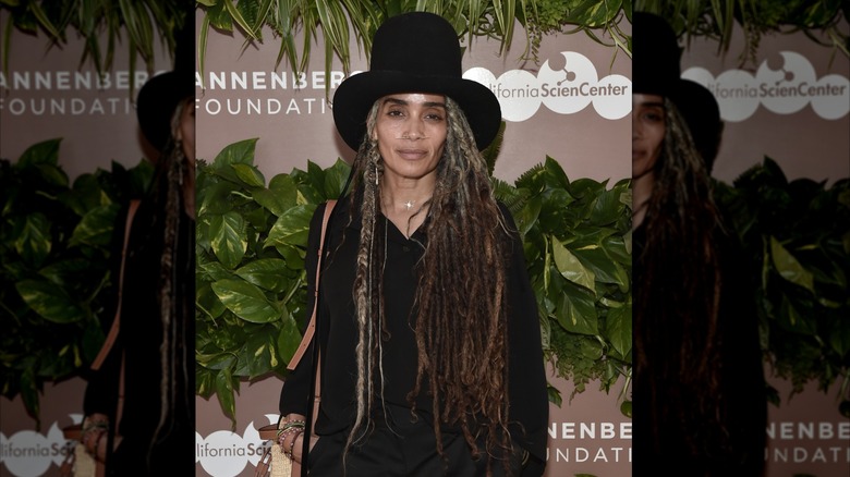 Lisa Bonet smiles on the red carpet in a black shirt