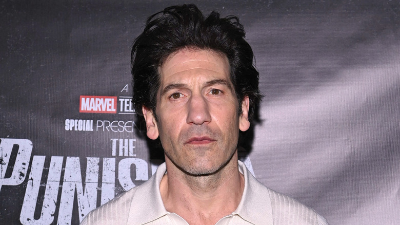 Jon Bernthal in front of a 'The Punisher: One Last Kill' backdrop