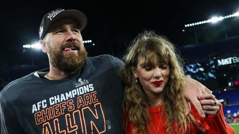 Travis Kelce and Taylor Swift celebrating the Chiefs' win against the Baltimore Ravens on January 28, 2024