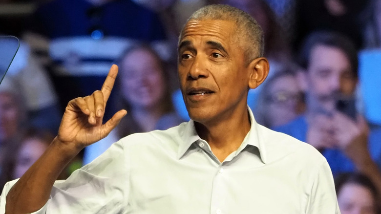 Barack Obama looking thoughtful and pointing his finger while speaking