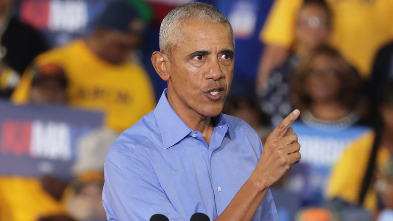 Barack Obama with a stern face and a pointed finger.