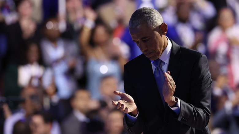 Barack Obama clapping in front of a crowd