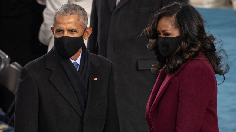 Michelle and Barack Obama wearing masks
