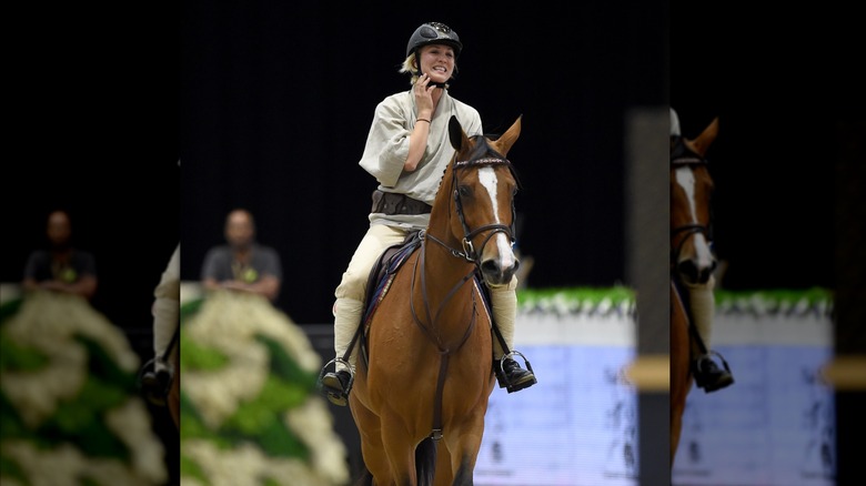 Kaley Cuoco riding a horse at an event in 2015