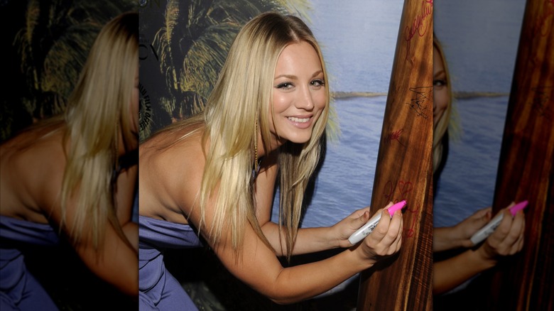 Kaley Cuoco signing a board at the 2011 Critics' Choice TV Awards