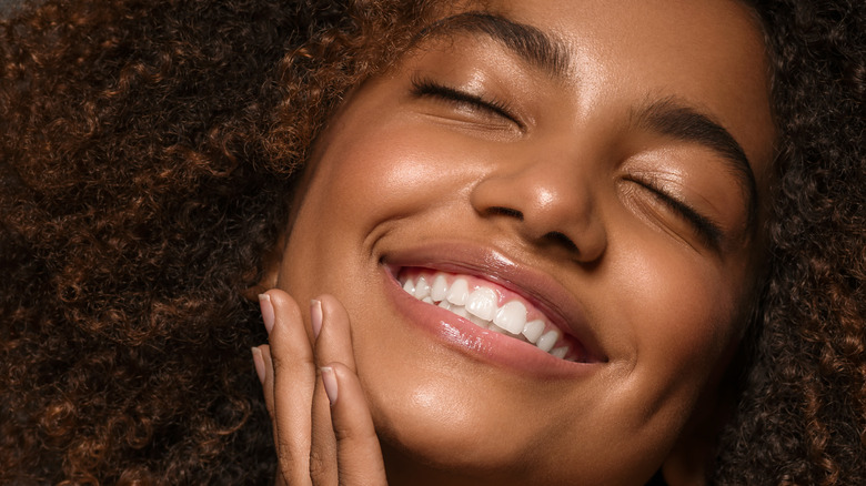 Woman smiling with smooth skin