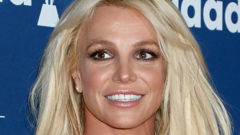 Britney Spears smiling onstage at an event