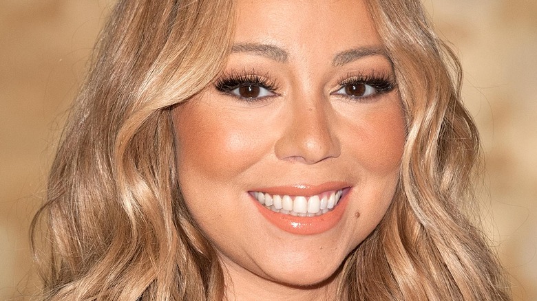 Mariah Carey smiling at an event