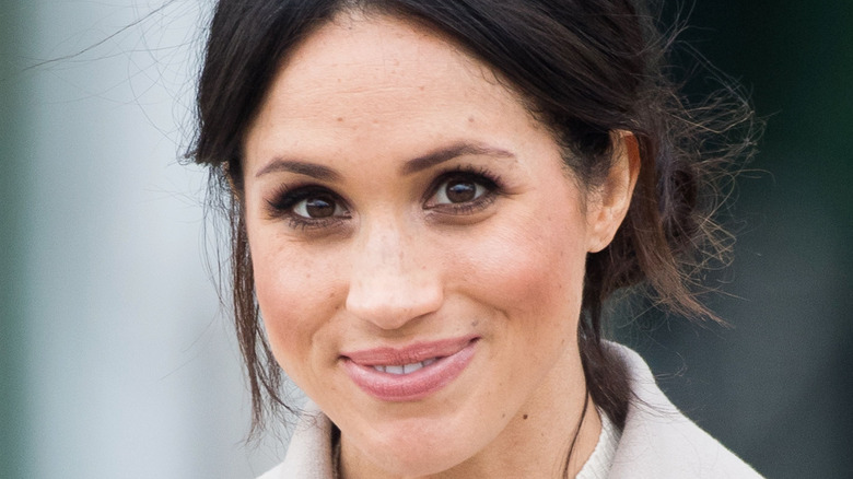 Meghan Markle smiling at camera