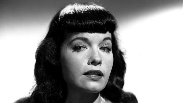 Bettie Page posing