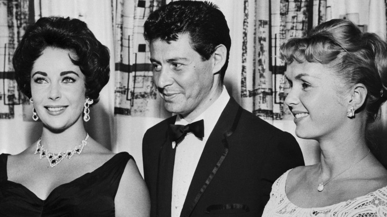 Elizabeth Taylor, Eddie Fisher, and Debbie Reynolds pose for a photo