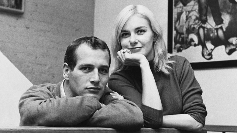 Paul Newman & Joanne Woodward pose for a photo in their home