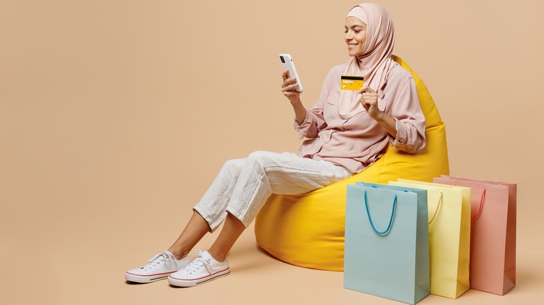 woman in hijab with shopping bags 