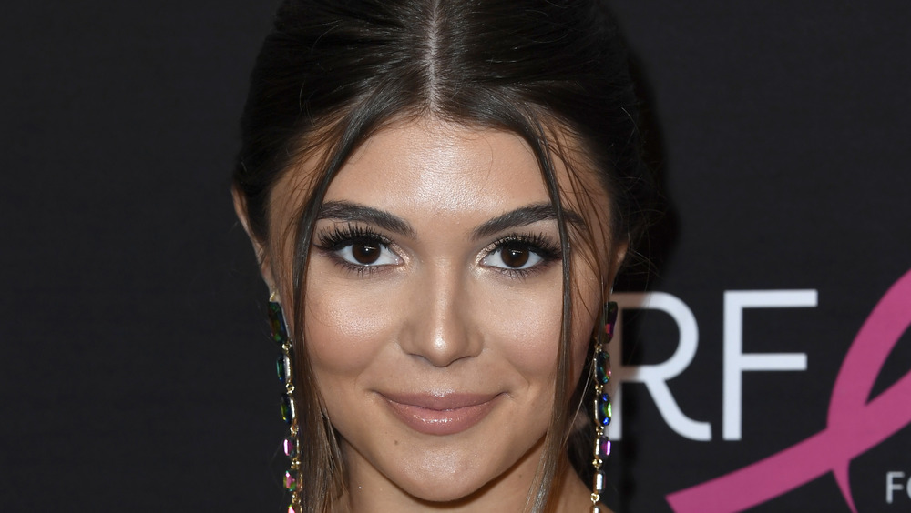 Olivia Jade poses on the red carpet at an event
