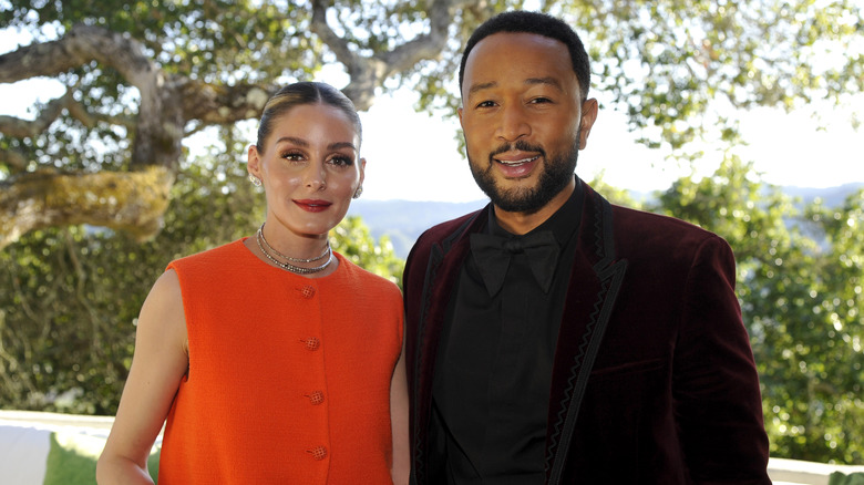 Olivia Palermo and John Legend smiling in Napa