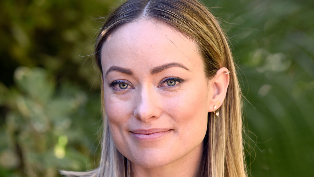 Olivia Wilde smiles at an event