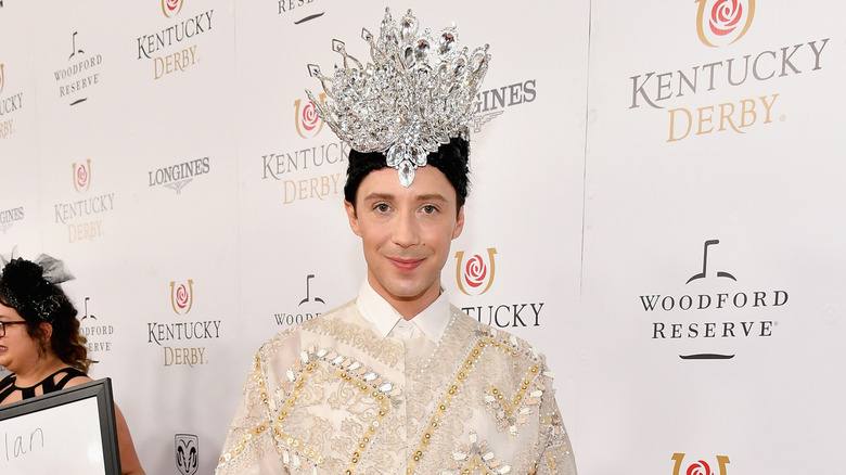 Johnny Weir wearing a silver headpiece