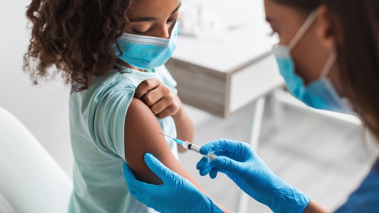 Young child receiving vaccine