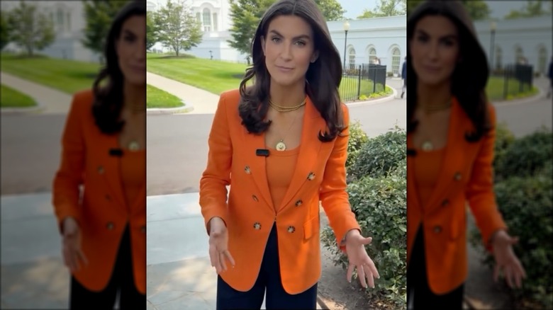 Kaitlan Collins wears orange blazer