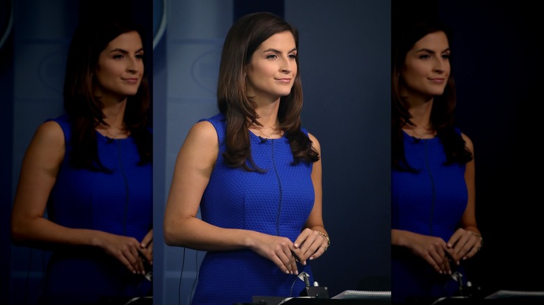 Kaitlan Collins wearing a dress