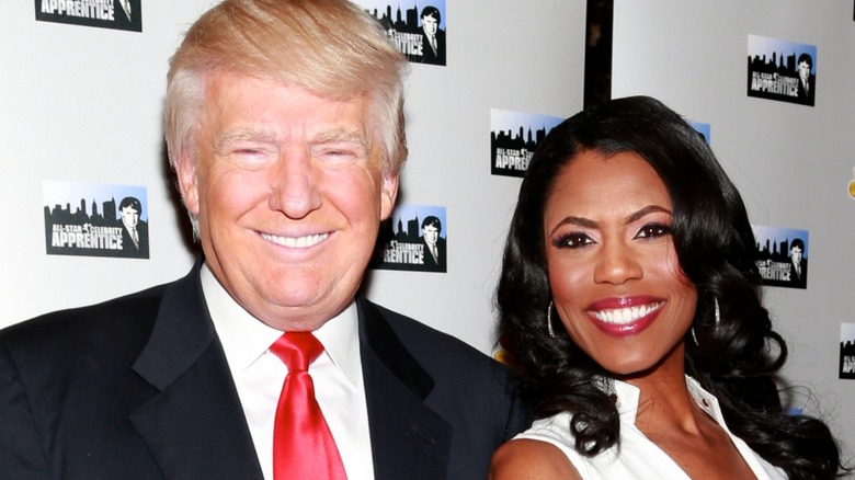 Donald Trump smiling with Omarosa Manigault Newman