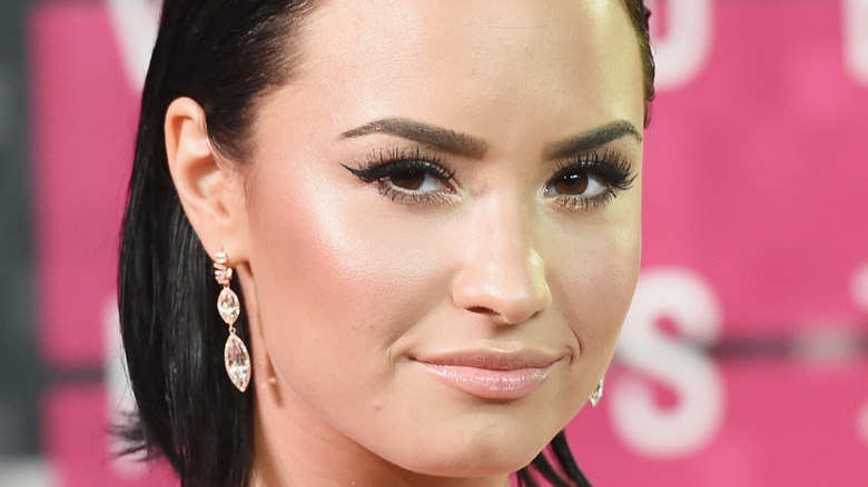 Demi Lovato poses on the red carpet