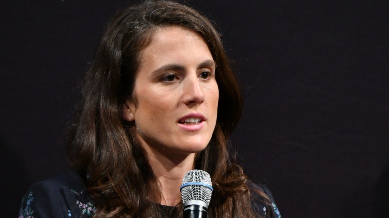 Tatiana Schlossberg holding microphone