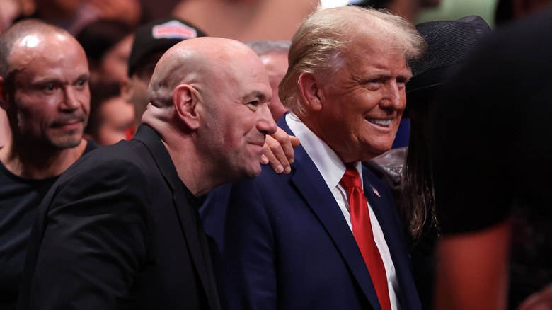 Joe Rogan standing beside Donald Trump with his hand on his shoulder