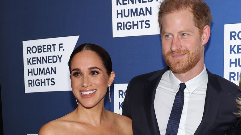 Prince Harry and Meghan Markle smiling